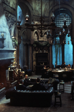 What is the role of the portraits in the Slytherin common room? 2